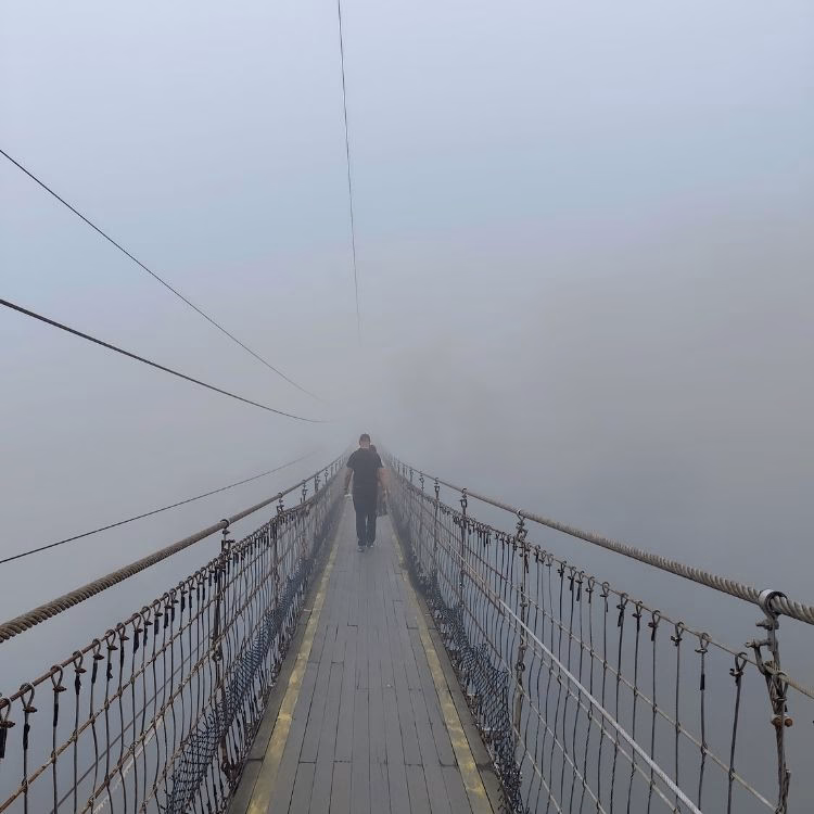 Foggy morning at Situgunung suspension bridge